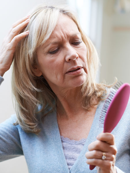 Older woman losing her hair