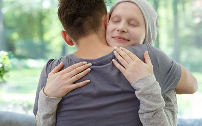 Lady wearing head scarf due to hair loss